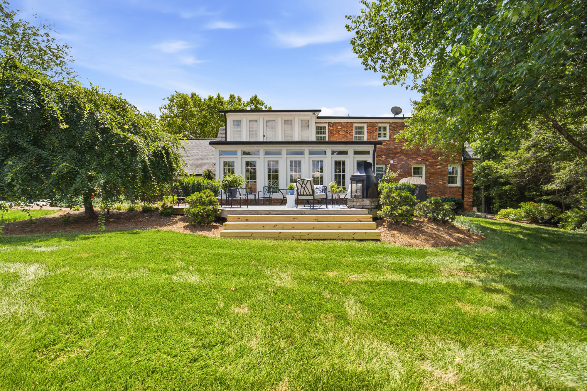 Rear lawn and brick residence at 3115 Oakmont Road
